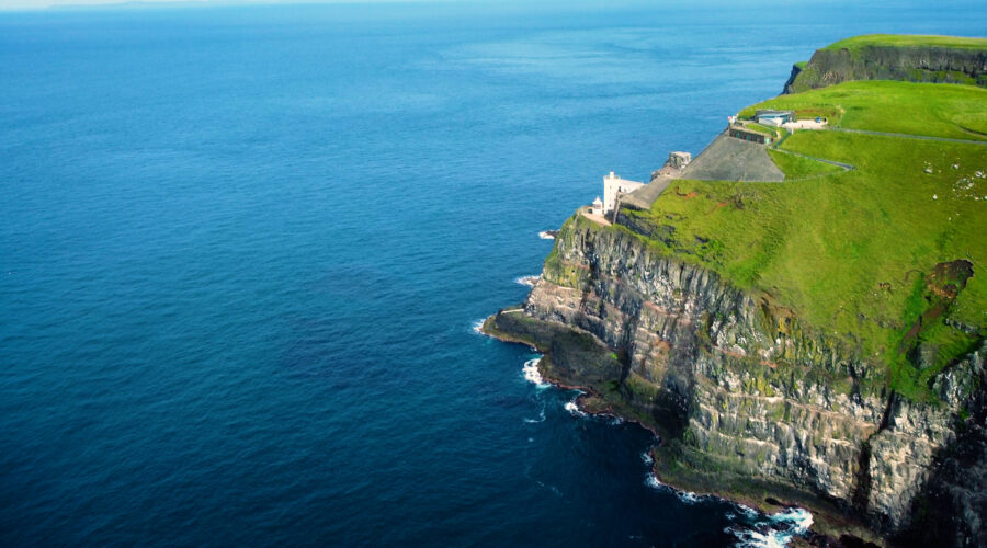 aerial drone view of a lighthouse on a cliff on Rathlin island overlooking the atlantic ocean