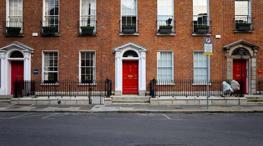 three red georgian doors on a Dublin street