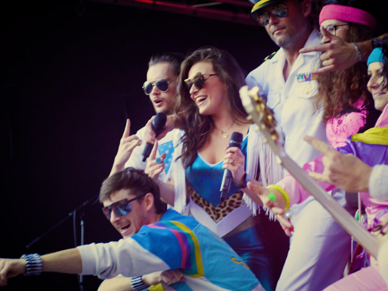 band performing on stage during an outdoor concert event