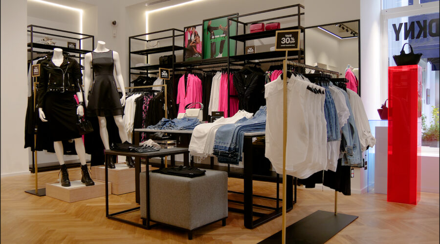 fashion boutique with clothes hanging on rails