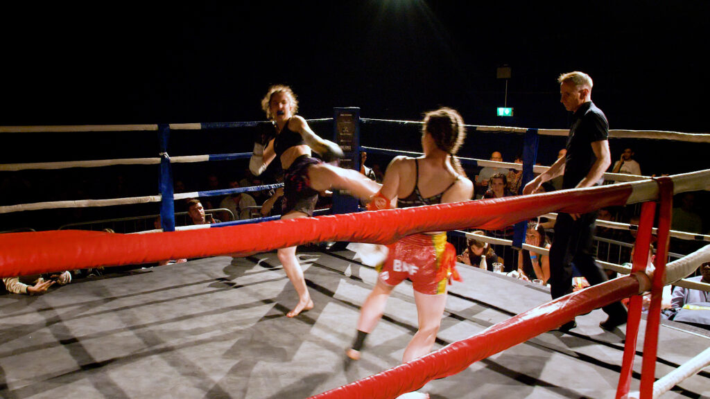 kickboxers fighting in ring