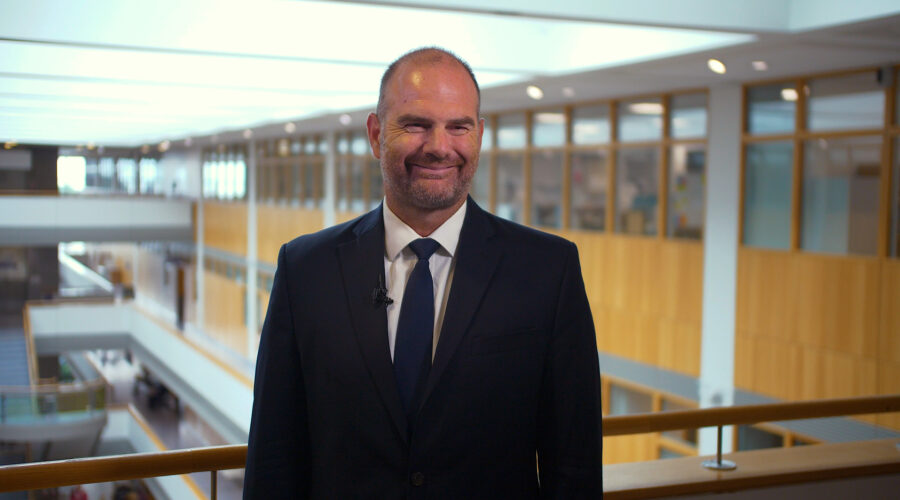 man-smiling-toward-camera