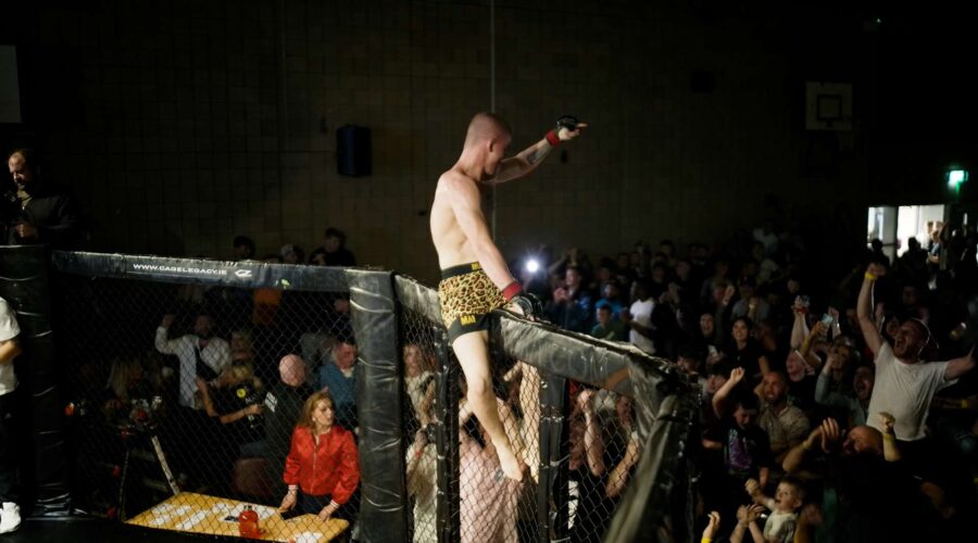 mma-fighter-on-side-of-cage