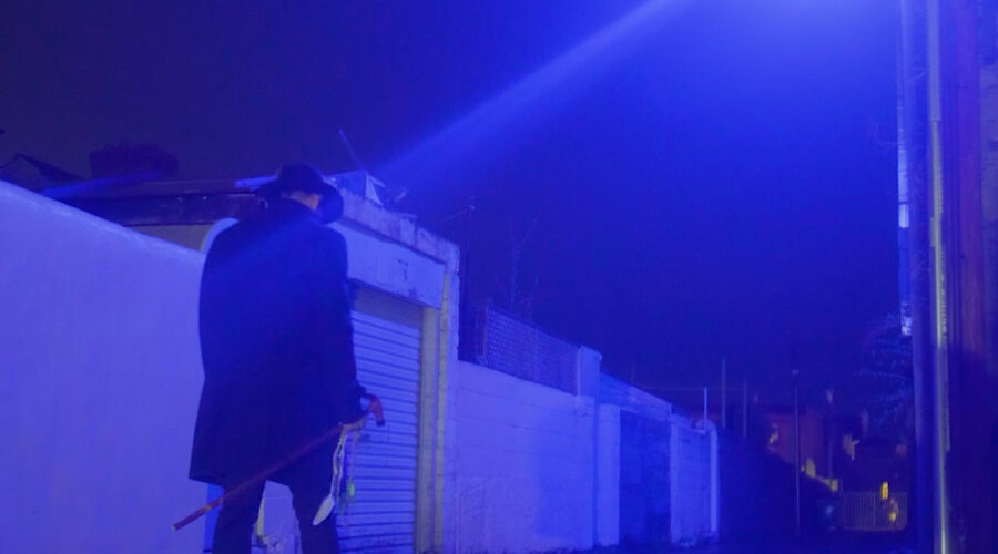 portrait shot of musicians in street with blue light