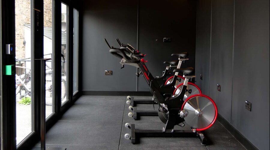 empty office gym with cycling machines