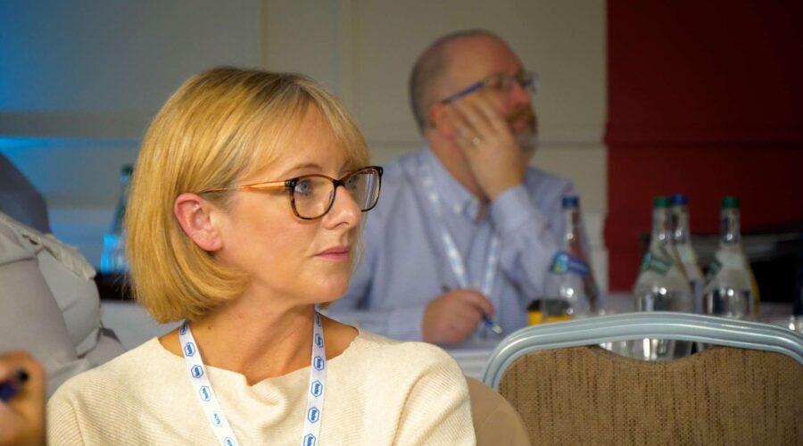 people listening at a business conference