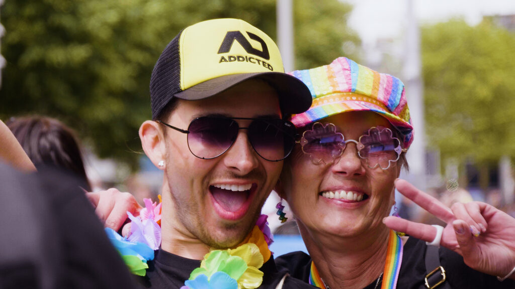 A man and woman smiling and posing for a photo at the Dublin Pride Parade