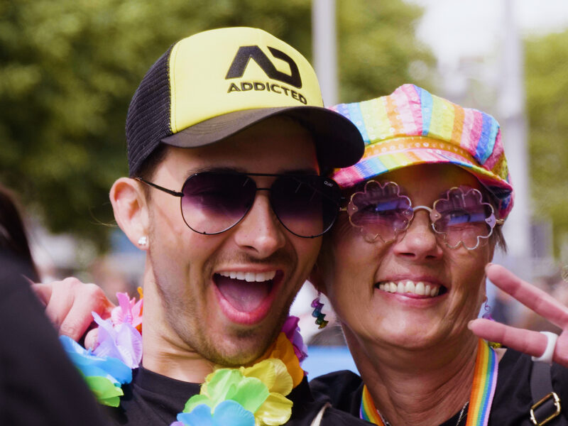 A man and woman smiling and posing for a photo at the Dublin Pride Parade