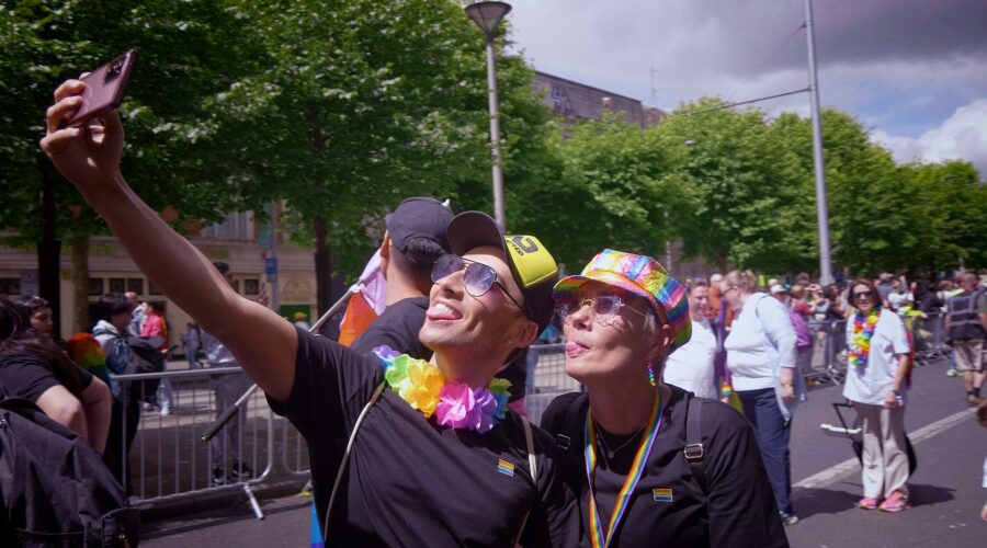 two people taking a selfie at the Dublin Pride Parade