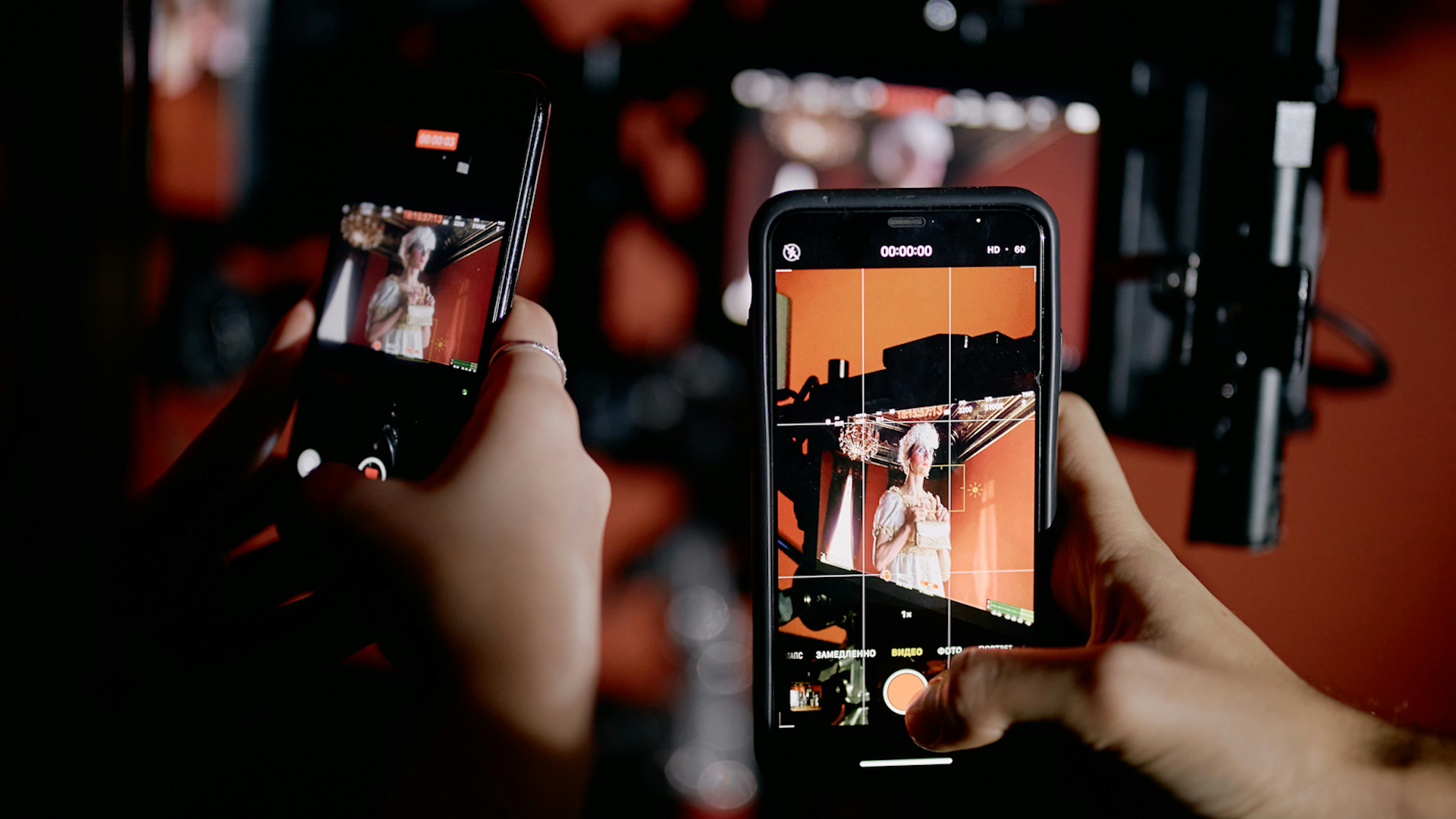 two smart phones and some camera equipment