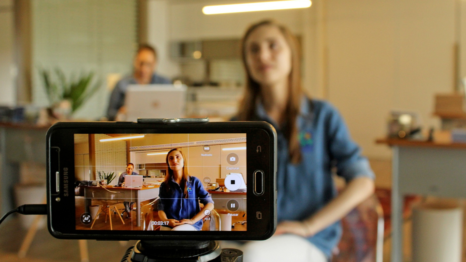 video production using a smart phone on a tripod to record a presentation