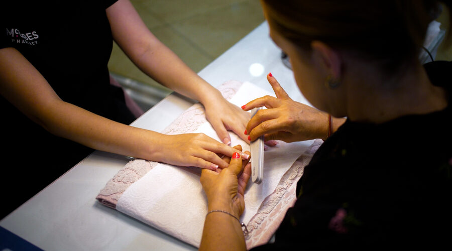 close up of a woman getting manicure